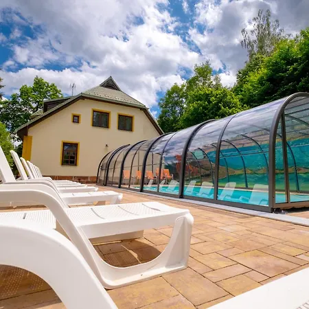With A Covered Pool, Park, And Playground *